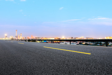 Fototapeta premium Panoramic beijing skyline and buildings with empty road
