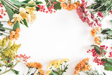 Autumn floral composition. Frame made of fresh flowers on white background. Autumn, fall concept....