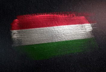 Hungary Flag Made of Metallic Brush Paint on Grunge Dark Wall