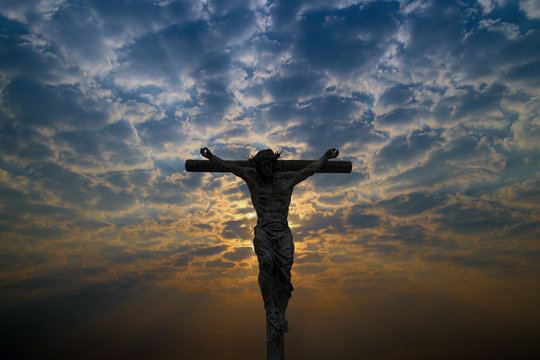 Silhouette of Jesus Christ crucifix cross on heaven