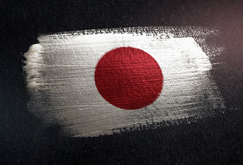 Japan Flag Made of Metallic Brush Paint on Grunge Dark Wall - 218907603