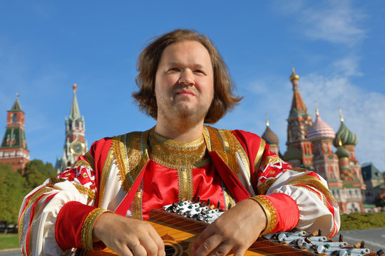 Musician with music instrument gusli