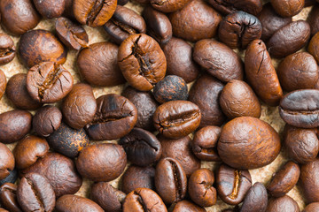 Closeup texture of coffee beans on the table. Coffee background