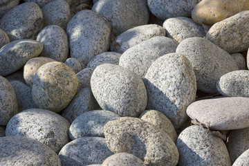 Heap of smooth pebble stones, background.