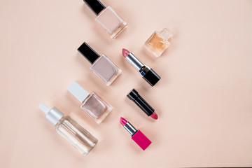 cosmetics top view on beige table. Workplace, cosmetics, lipstick, nail Polish,make up pettern.Set of decorative cosmetics on pastel background.Top view. Copy space.cosmetics, accessories, makeup