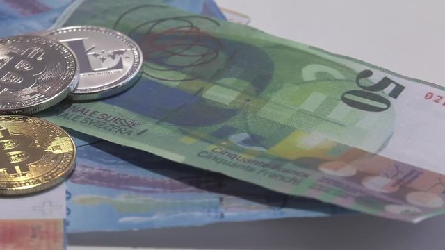 Physical metal Bitcoin currency over bolivar bills. Virtual internet money with Venezuelan banknotes. Digital coin cyberspace, cryptocurrency. BTC golden coin as symbol of electronic virtual money. 4K