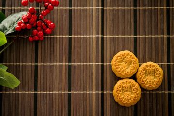 Top down mooncakes on bamboo mat
