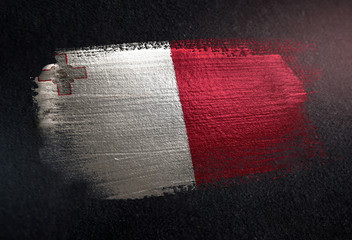 Malta Flag Made of Metallic Brush Paint on Grunge Dark Wall
