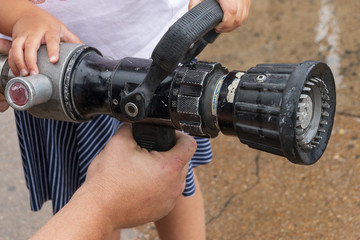Hands Holding A Water Hose