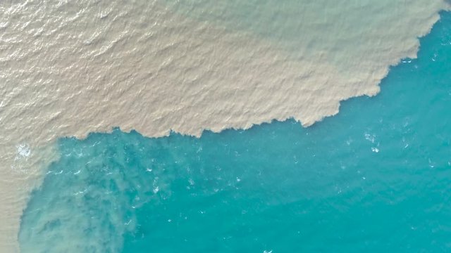 Aerial view of river and sea waters mixing in Rio, Patras city, Greece.
