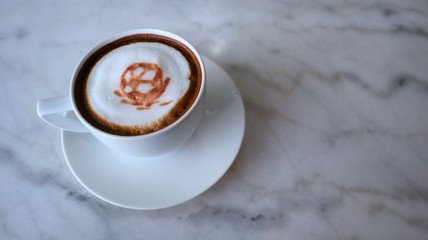 football coffee latte art on white cup