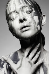 liquid paint flowing over a beautiful face and Body