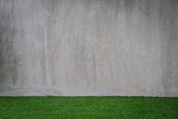 Green grass artificial turf pattern with gray cement wall - Powered by Adobe