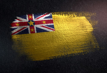 Niue Flag Made of Metallic Brush Paint on Grunge Dark Wall