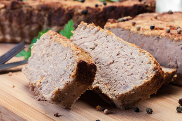 Traditional delicious meat pate with chicken liver on cutting board