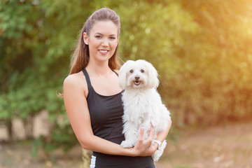 Bichon bolognese dog with beautiful in the park