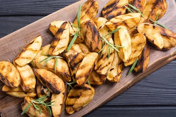 Tuinposter Homemade grilled potatoes with rosemary © whitestorm