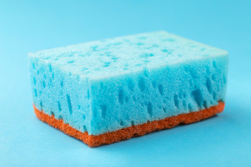 Sponges for dishwashing. Kitchen equipment. Blue background