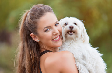 Bichon bolognese dog with beautiful in the park