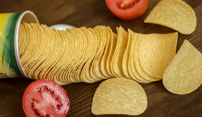 chips with tomato in a wood table