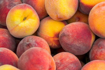 fresh ripe peaches in the box ready for sale