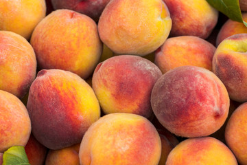 Fototapeta na wymiar fresh ripe peaches in the box ready for sale