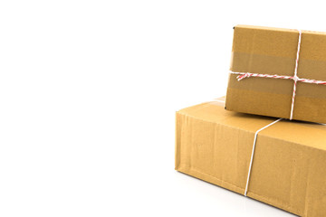 Two brown paper box  tied with red and white string ready to send isolated