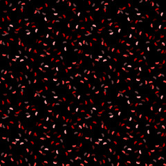 Elegant black seamless pattern with chaotic sparks in different shades of red and pink