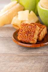 fresh and peeled pomelo(shaddock), grapefruit with slices and mooncake in mid-autumn festival(moon festival)
