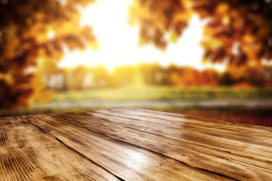 Table background and autumn landscape 