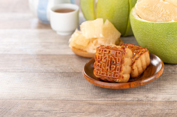 fresh and peeled pomelo(shaddock), grapefruit with slices and mooncake in mid-autumn festival(moon...