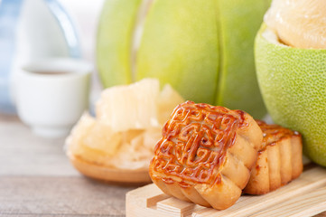 fresh and peeled pomelo(shaddock), grapefruit with slices and mooncake in mid-autumn festival(moon festival)