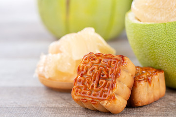 fresh and peeled pomelo(shaddock), grapefruit with slices and mooncake in mid-autumn festival(moon festival)