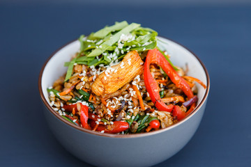 A plate of a wok rice on the dark background