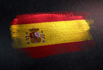 Spain Flag Made of Metallic Brush Paint on Grunge Dark Wall