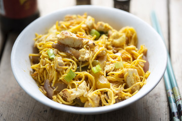 Singapore noodles, stir-fried noodles, chicken breast with egg, mixed greens in curry sauce