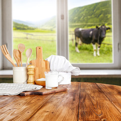 Fototapeta na wymiar Table background and window space with cow on grass. 