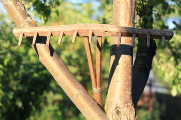 Old hand-made rake for hay in the village