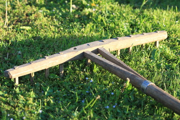 Old hand-made rake for hay in the village
