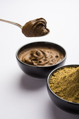 Henna / Mehandi powder and paste. Prepared for Hair colouring or for tattoo on hand in Indian weddings/festivals. selective focus