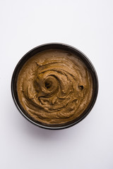 Henna / Mehandi powder and paste. Prepared for Hair colouring or for tattoo on hand in Indian weddings/festivals. selective focus