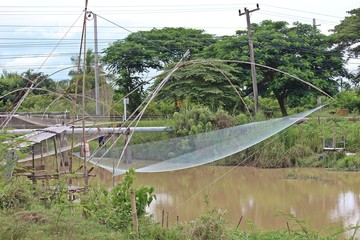 Dip net,  be equipment for fishing of Thai people,  use it at the river and the canal.