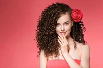 Beautiful curly hairstyle woman with red lips beauty makeup perfect hair