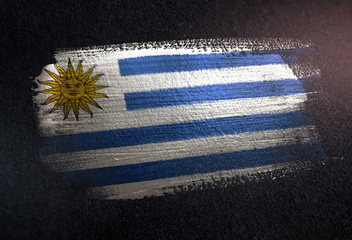 Uruguay Flag Made of Metallic Brush Paint on Grunge Dark Wall