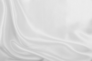Smooth elegant white silk or satin luxury cloth texture as wedding background. Luxurious background design