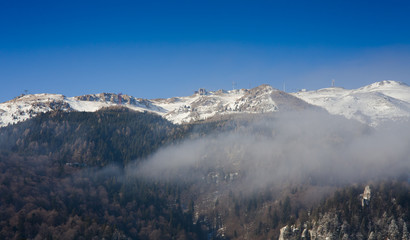 Bucegi mountains in winter. View of Sinaia cable for ski