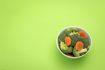 Broccoli and carrot salad in white bowl