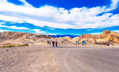 CALIFORNIA, USA - FEBRUARY 3, 2018: People on the road in the Death Valley. Copy space for text.