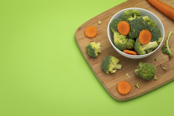 Broccoli and carrot mixed in white bowl