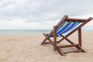 Beach chair on the sand with sea and sky